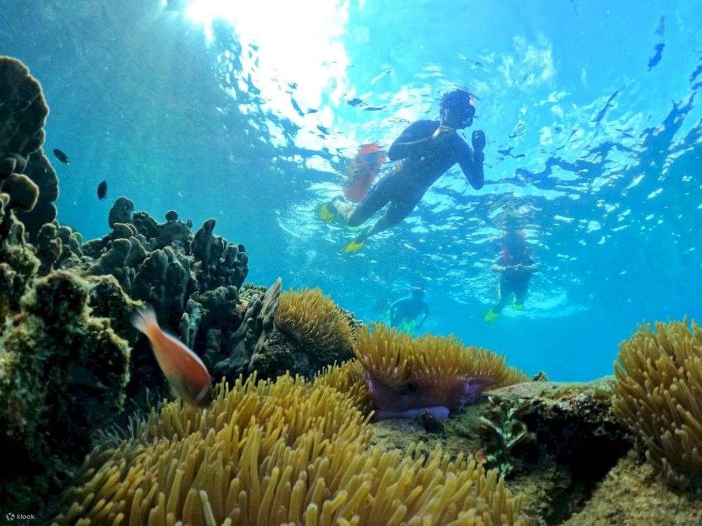 The calm, shallow waters at Khem Beach are perfect for activities like snorkeling and stand-up paddleboarding